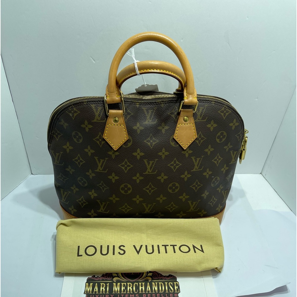 Loui Vuitton Alma in Monogram, with dust bag.